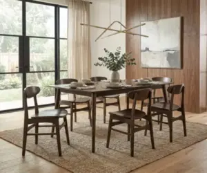 Designing rooms around key pieces with a solid wood dining table and matching chairs.
