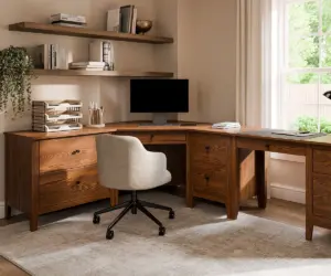 Custom Amish office furniture with a solid wood corner desk, storage drawers, and floating shelves.